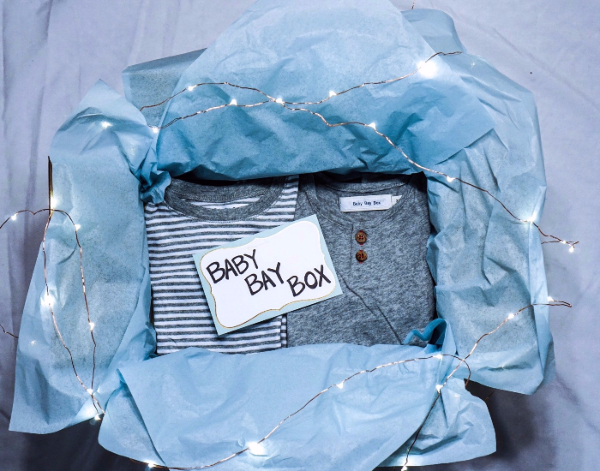 open box of kids clothing