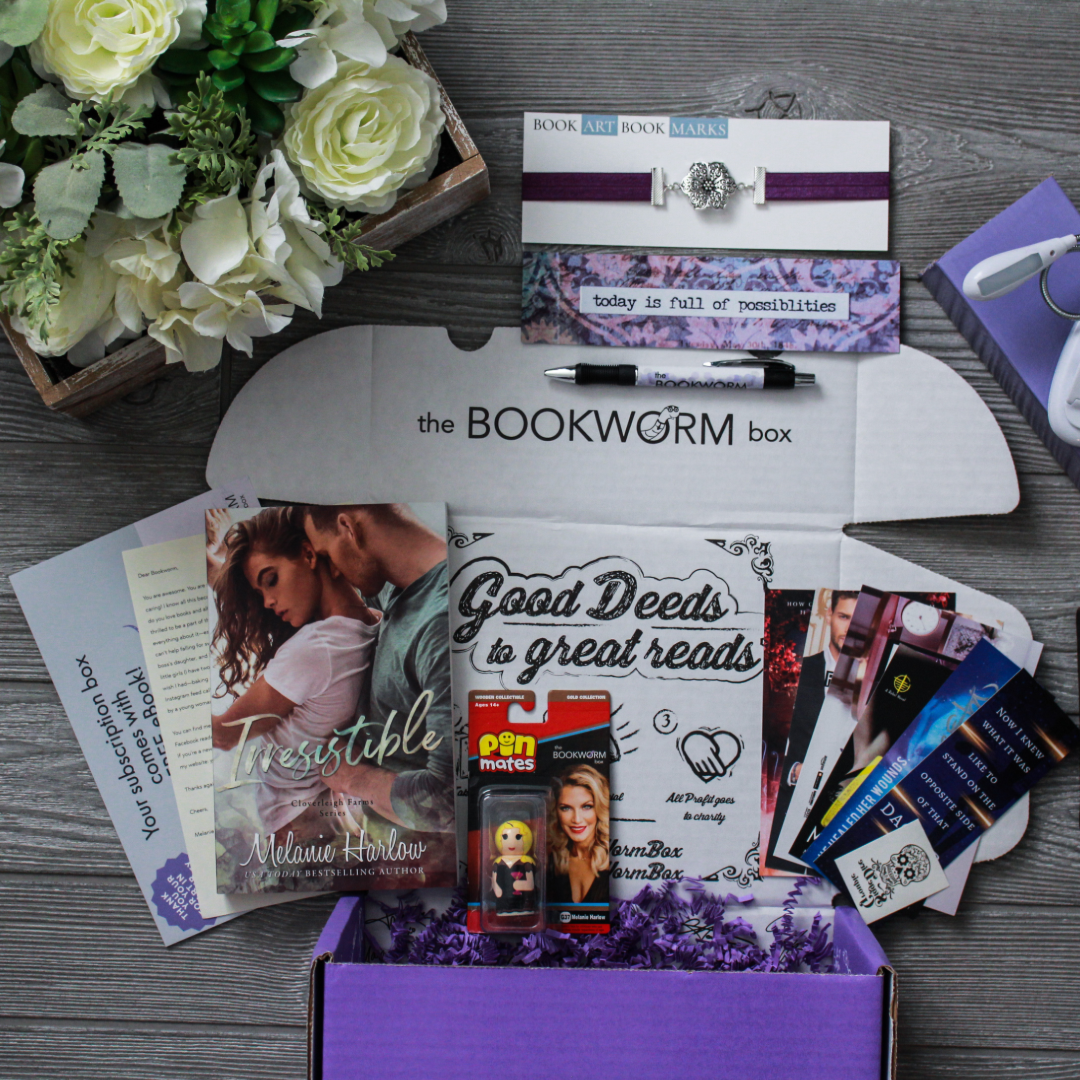 The Bookworm Box displayed with a flower arrangement and all items unpacked.